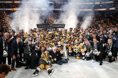 The Golden Knights pose for a team photo after Vegas beat the Florida Panthers 9-3 in Game 5 to win the Stanley Cup Final at T-Mobile Arena on June 13.